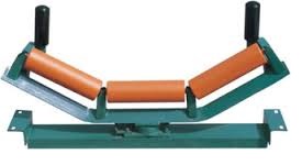A self aligning idler: three rollers on a frame that pivots, with a guide roller standing at each end. A self aligning idler: three rollers on a frame that pivots, with a guide roller standing at each end.