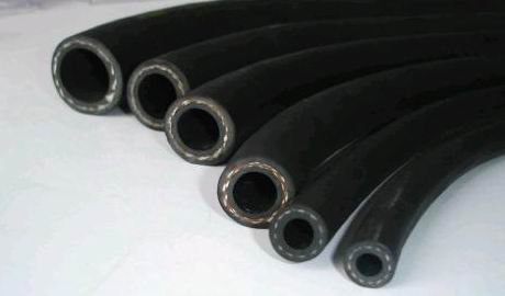 Five compressed air hoses of different bores laid side by side, each cut square at the end. Five compressed air hoses of different bores laid side by side, each cut square at the end.