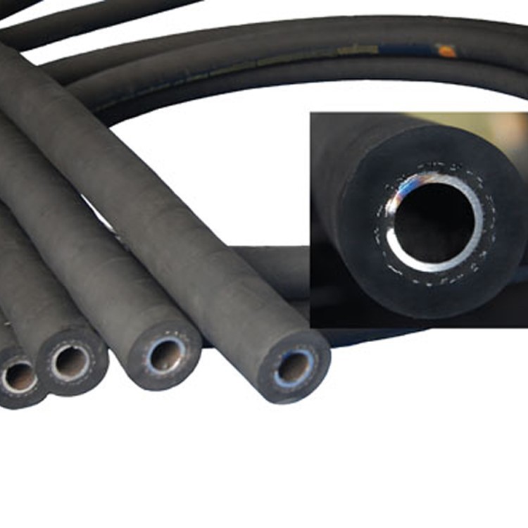 Concrete vibrator hoses of several bores, with one shown end on to reveal its spring lining. Concrete vibrator hoses of several bores, with one shown end on to reveal its spring lining.