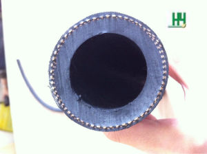 A hand holding a length of sandblast hose end on, showing the thick natural rubber lining inside the bore. A hand holding a length of sandblast hose end on, showing the thick natural rubber lining inside the bore.
