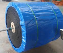 A finished roll of conveyor belting on its axle, wrapped in blue sheeting and strapped for dispatch.