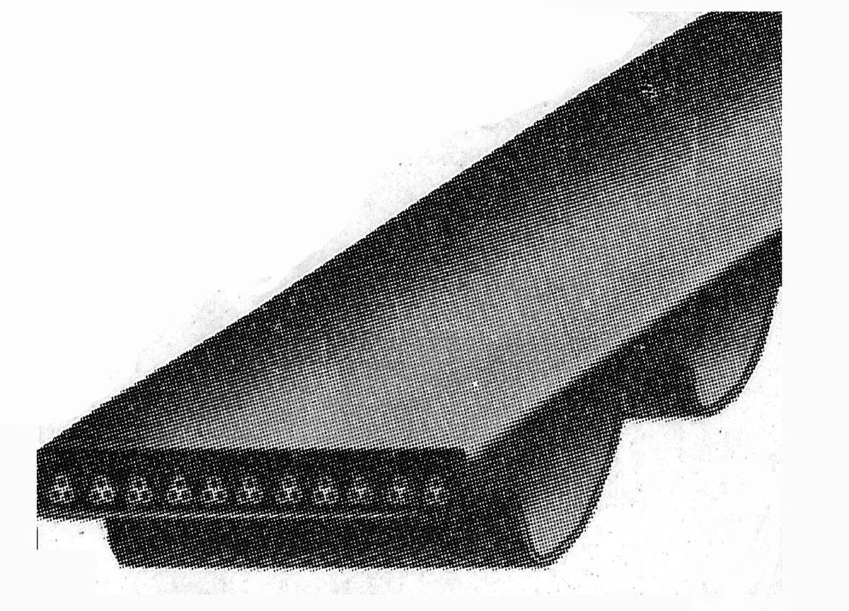 A synchronous timing belt, the moulded teeth along its inner face and the cords above them.