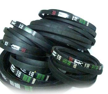A pile of finished V belts, each printed with its section and length.