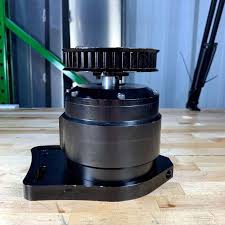A PK section belt pulley fitted to the head of a vacuum pump on the bench.