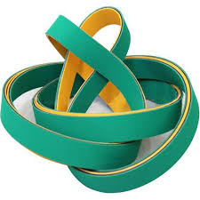 Green and yellow nylon transmission belts looped loosely together. Green and yellow nylon transmission belts looped loosely together.