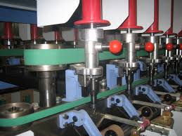 A green flat belt driving the head of a textile machine. A green flat belt driving the head of a textile machine.