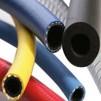 Delivery hoses in yellow, red, blue and black, gathered with their cut ends to the camera. Delivery hoses in yellow, red, blue and black, gathered with their cut ends to the camera.