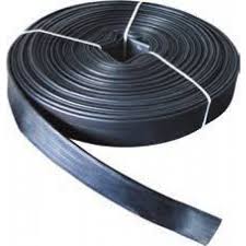 A coil of layflat discharge hose, flat where it is wound and round at the open end. A coil of layflat discharge hose, flat where it is wound and round at the open end.