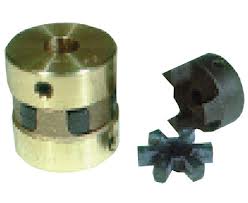 A brass bodied spider coupling beside the rubber element and the hub that fit into it. A brass bodied spider coupling beside the rubber element and the hub that fit into it.
