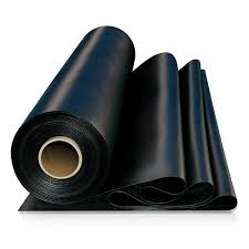 Rolls of synthetic rubber sheeting, one standing on its core and one folded over in front. Rolls of synthetic rubber sheeting, one standing on its core and one folded over in front.