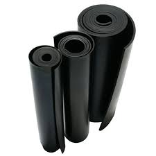 Four rolls of rubber sheeting of different widths standing together. Four rolls of rubber sheeting of different widths standing together.