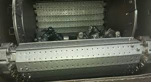 The inside of a shot blasting machine, its drum lined with rubber sheet. The inside of a shot blasting machine, its drum lined with rubber sheet.