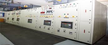 Matting running the length of a control panel room, in front of the instrument boards.