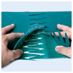 Two hands fitting the interlocking Z shaped fingers of a belt joint together. Two hands fitting the interlocking Z shaped fingers of a belt joint together.